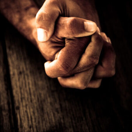 Male hands in prayer